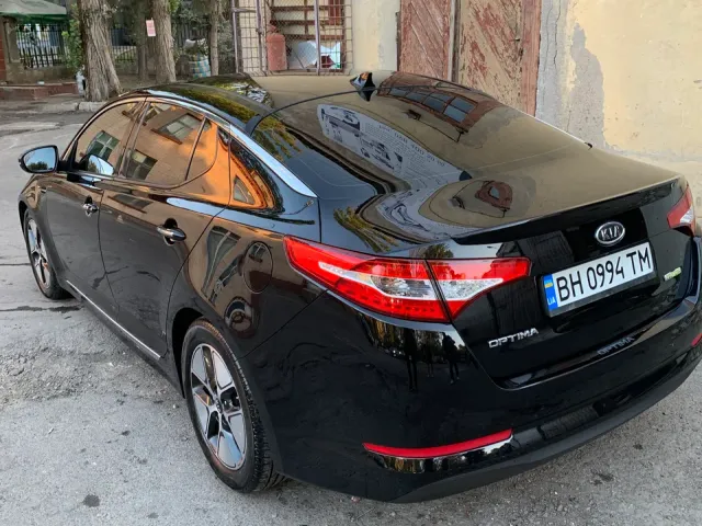Kia Optima - фото 5
