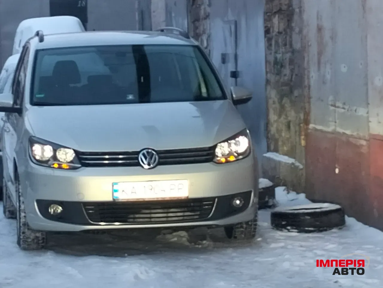 Volkswagen Touran - фото 1