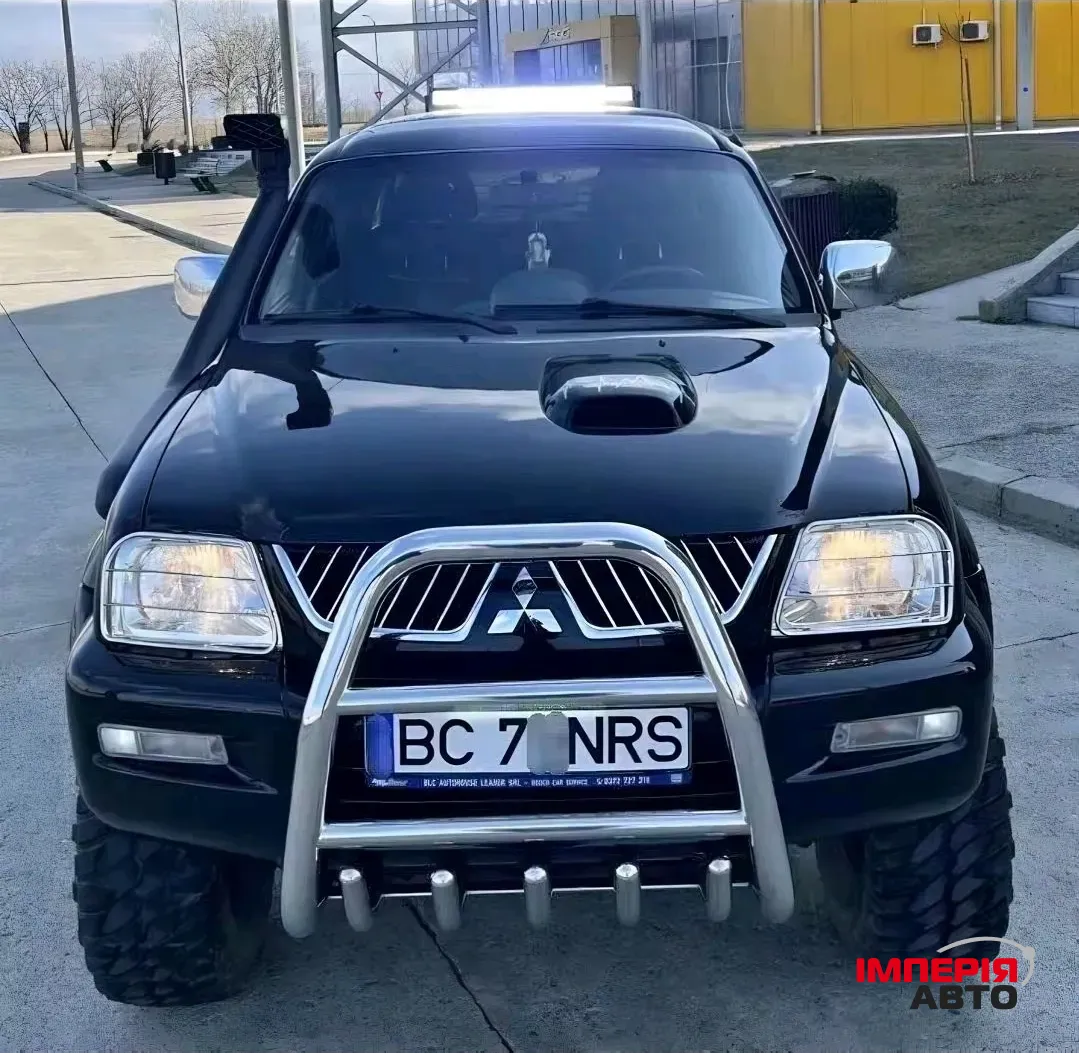 Mitsubishi L200 - фото 1