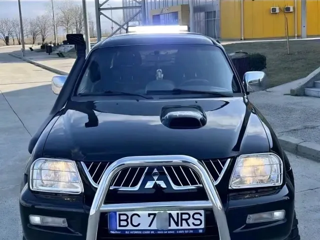 Mitsubishi L200 - фото 1