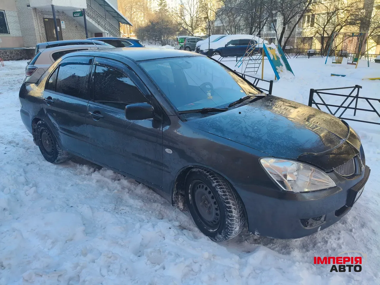 Mitsubishi Lancer - фото 1