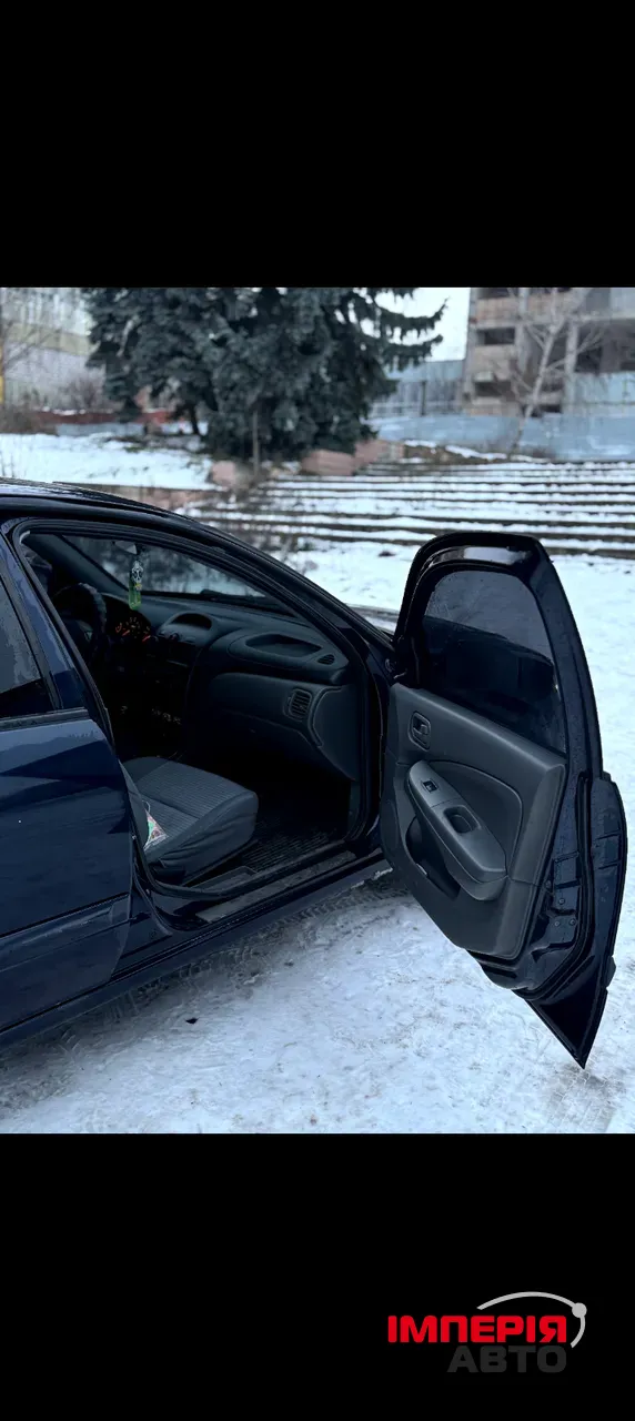 Nissan Almera Classic - фото 7