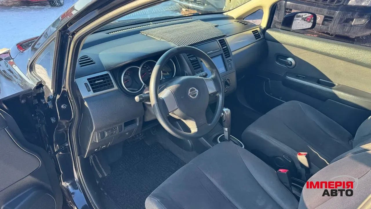 Nissan Tiida - фото 12