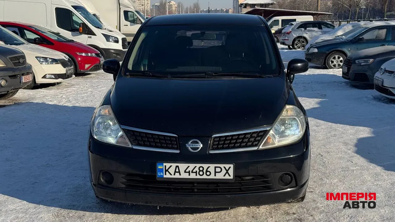 Nissan Tiida - фото 28