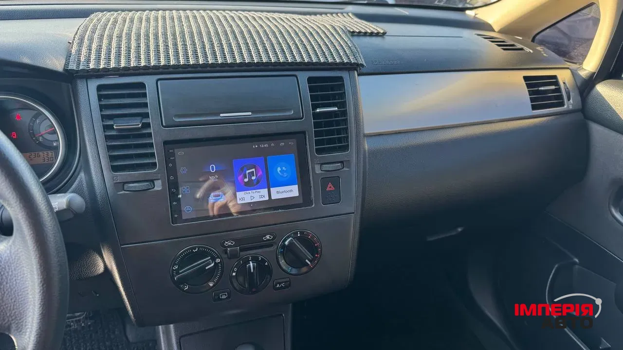 Nissan Tiida - фото 17