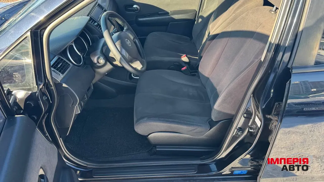 Nissan Tiida - фото 14