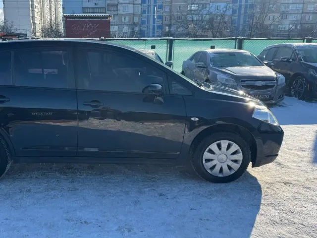 Nissan Tiida - фото 3