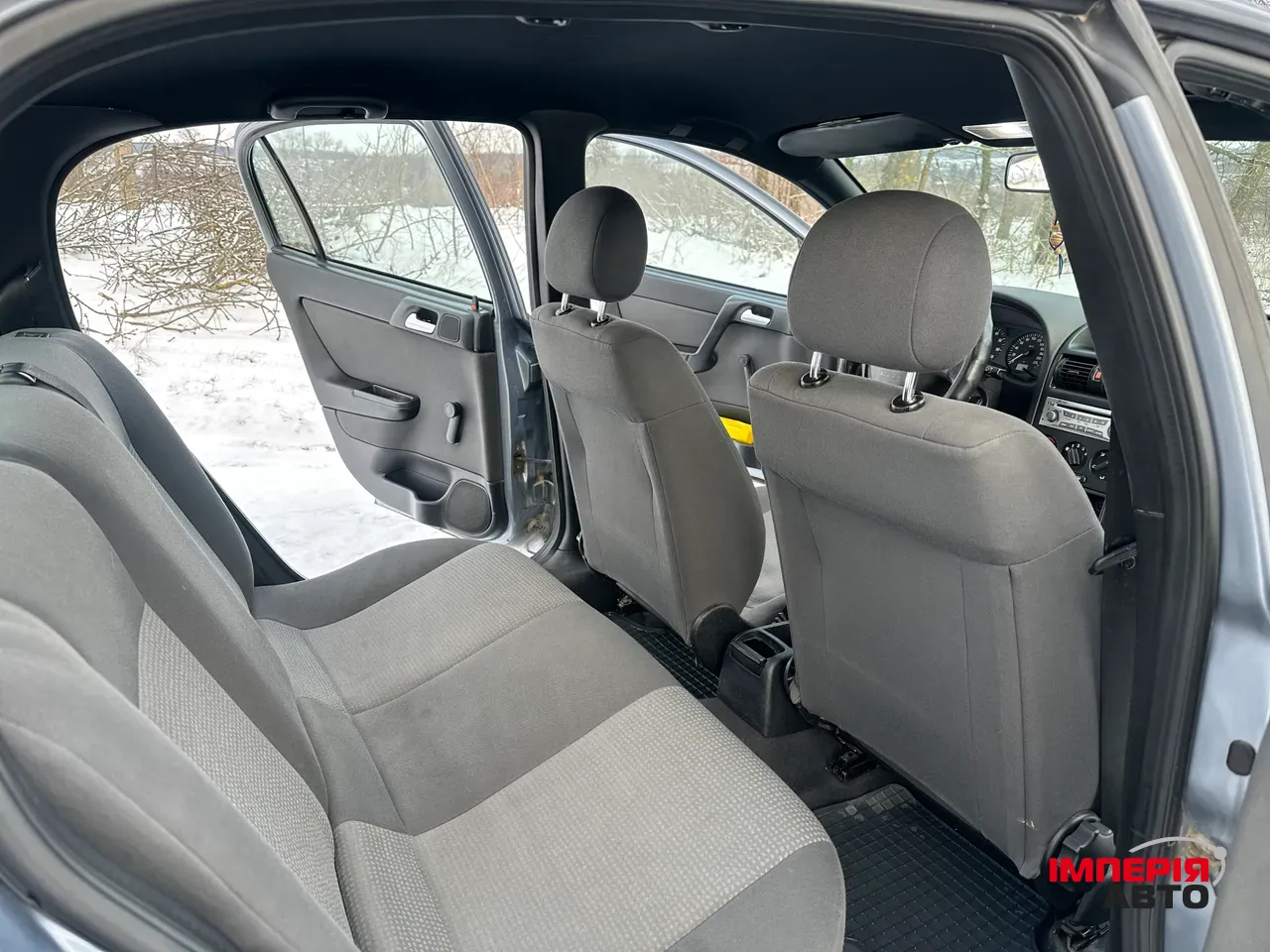 Opel Astra - фото 8