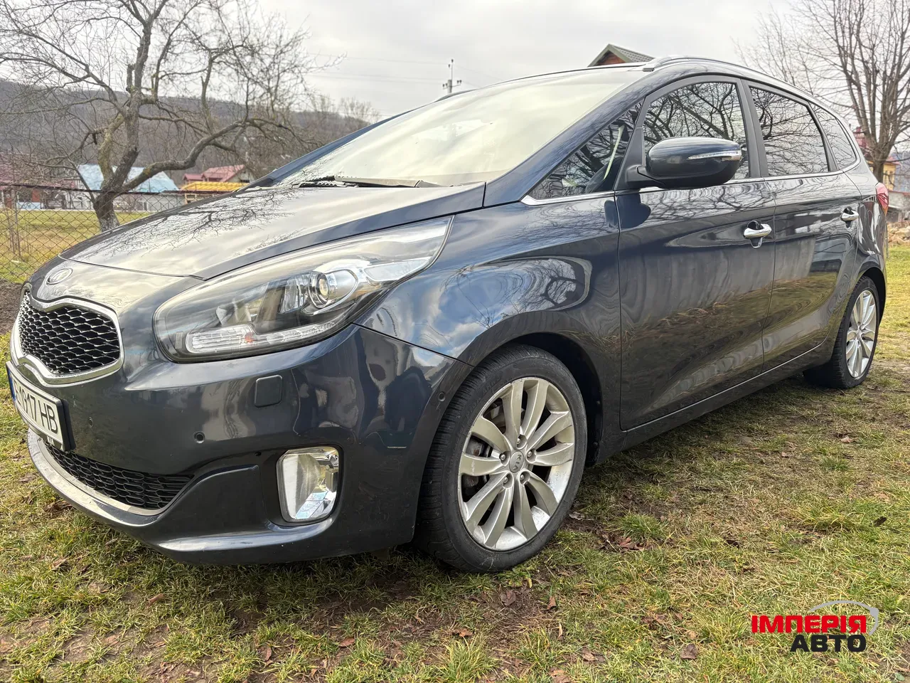 Kia Carens - фото 1