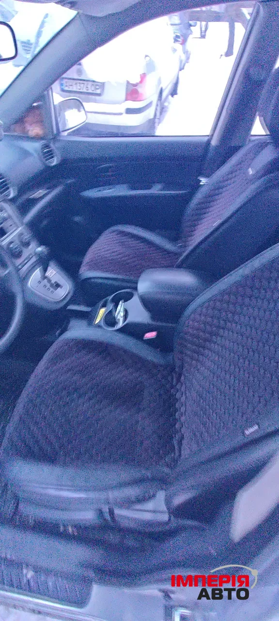 Kia Carens - фото 5