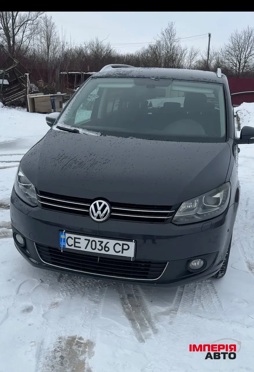 Volkswagen Touran - фото 1