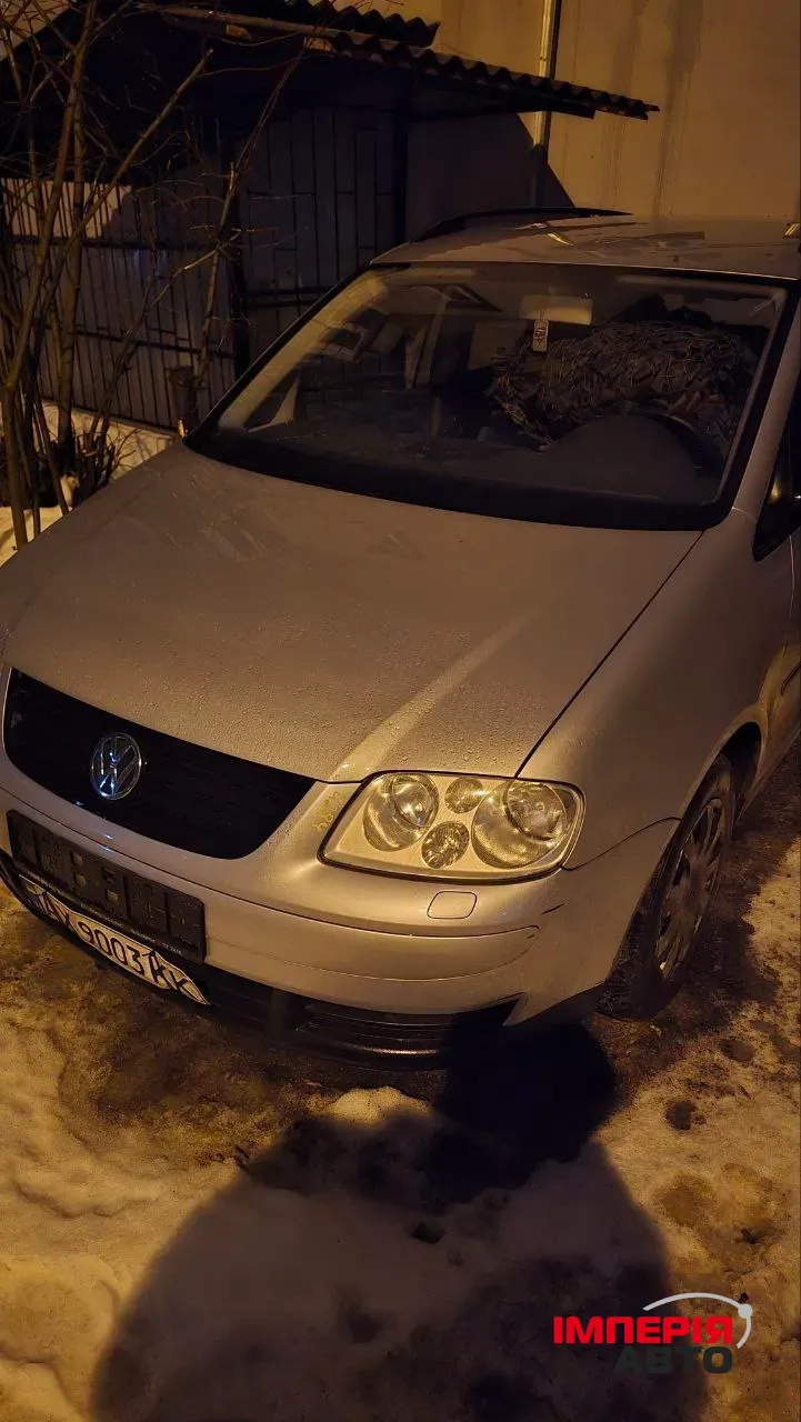 Volkswagen Touran - фото 1