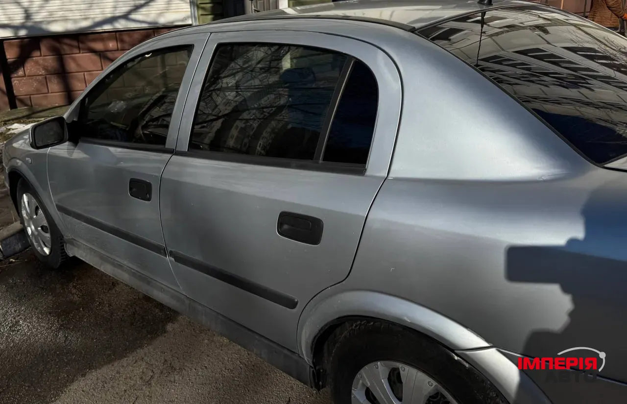 Opel Astra - фото 11