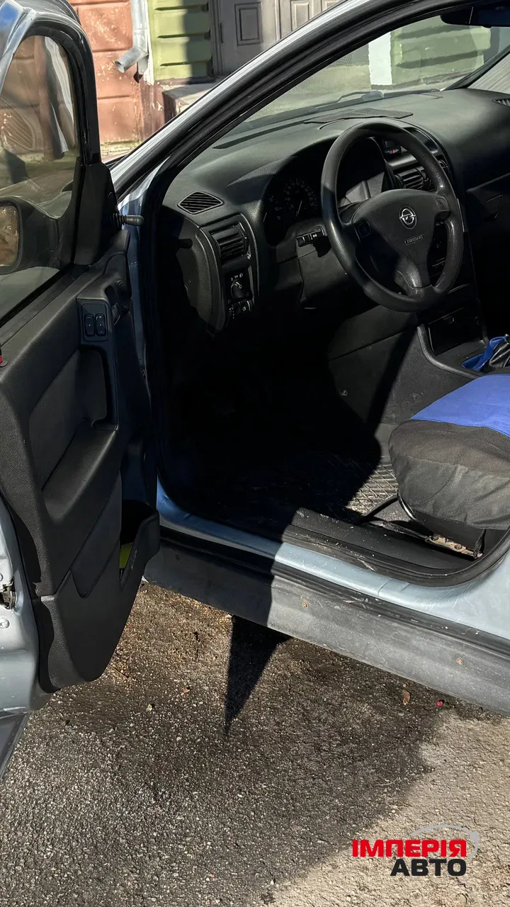 Opel Astra - фото 12