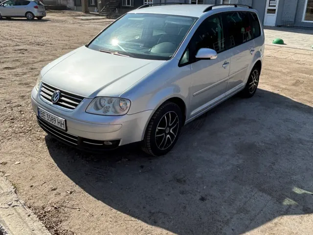 Volkswagen Touran - фото 1