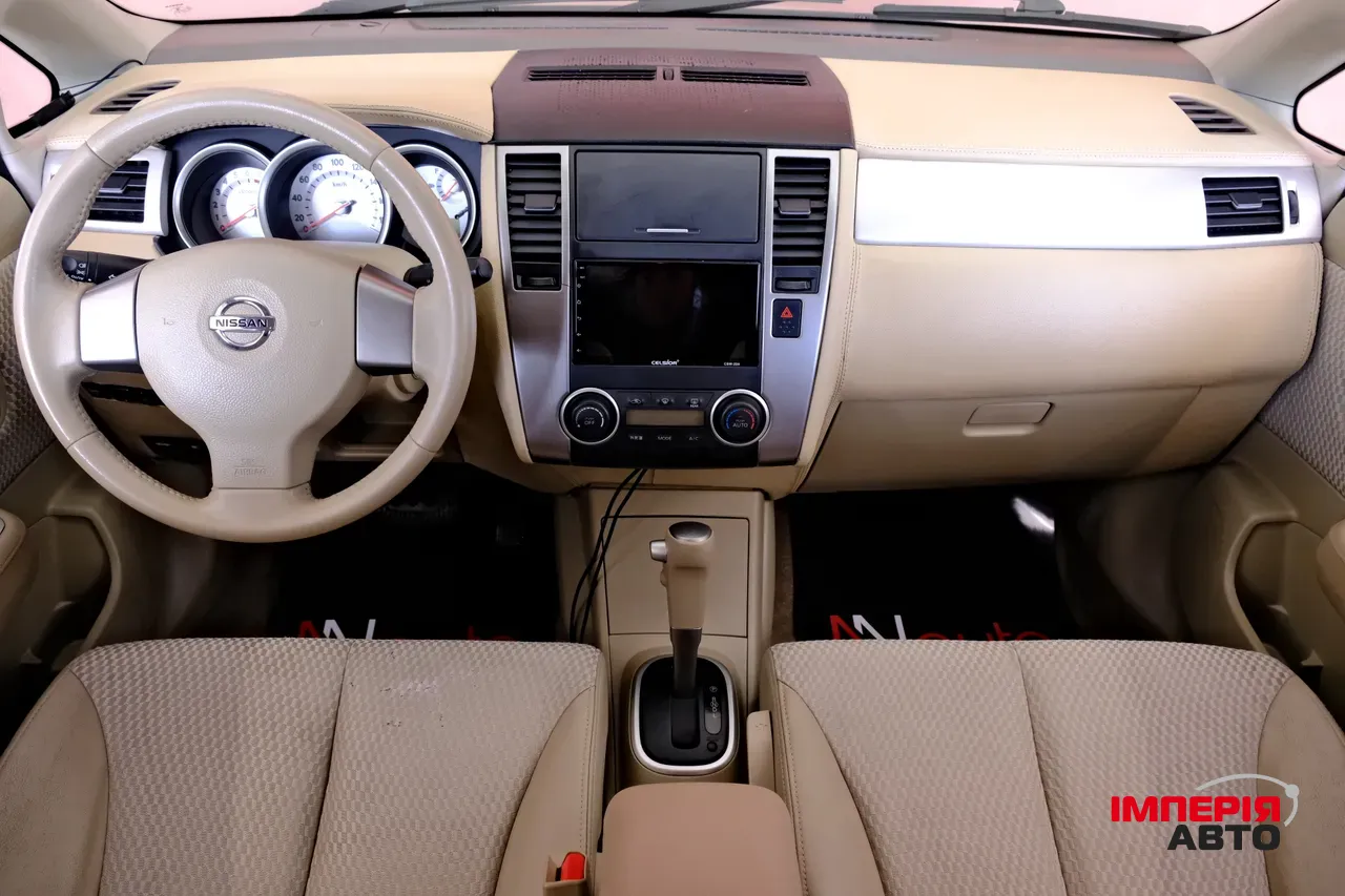 Nissan Tiida - фото 7