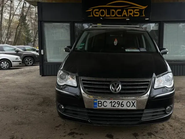 Volkswagen Touran - фото 1