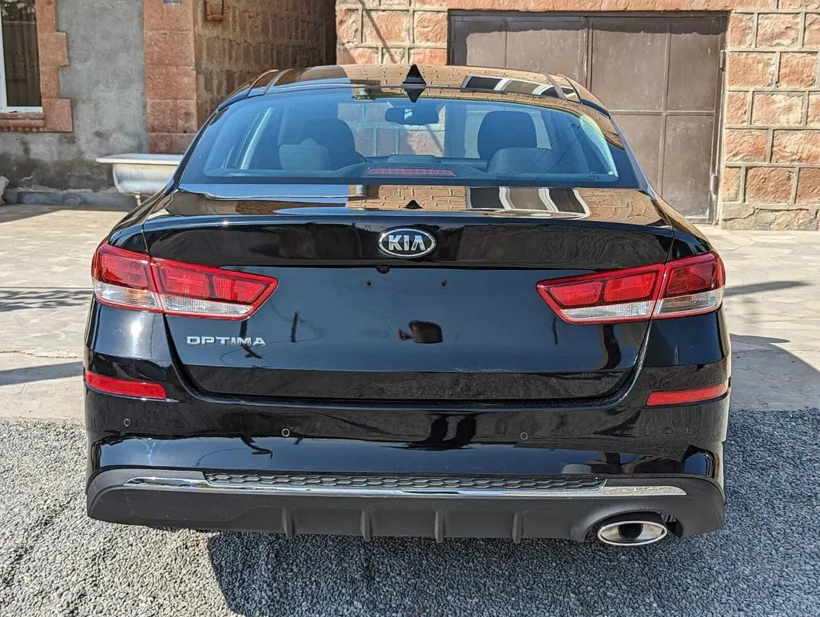 Kia Optima - фото 5