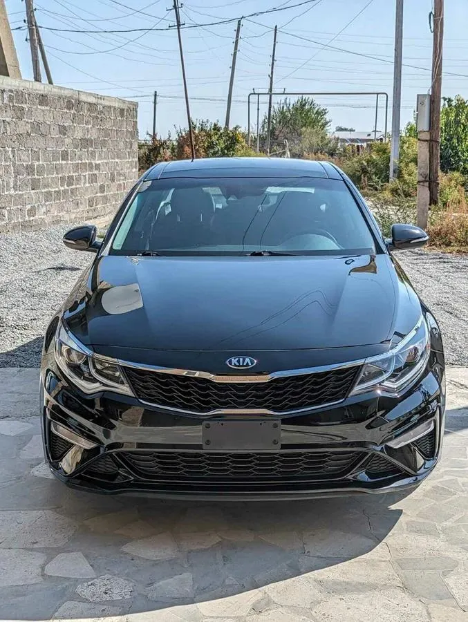 Kia Optima - фото 1