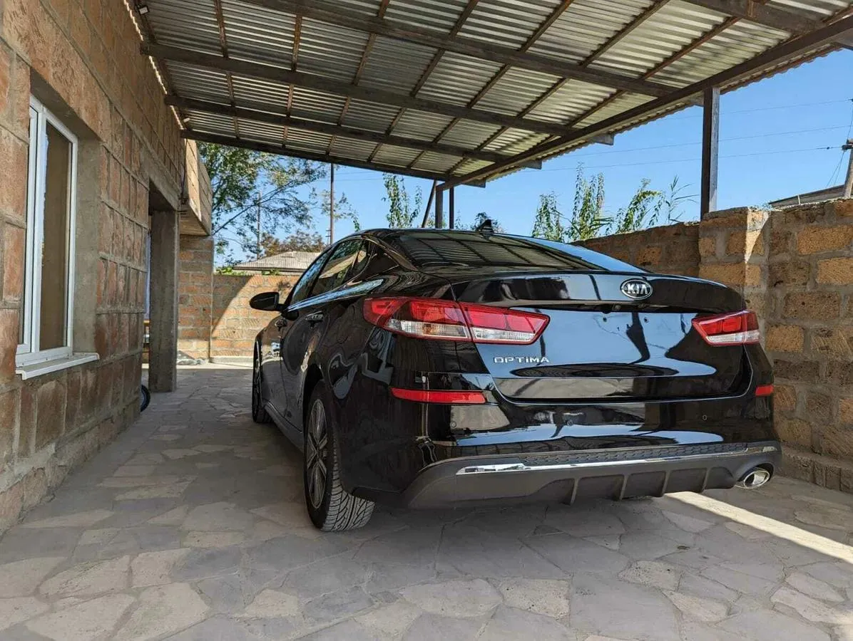 Kia Optima - фото 6
