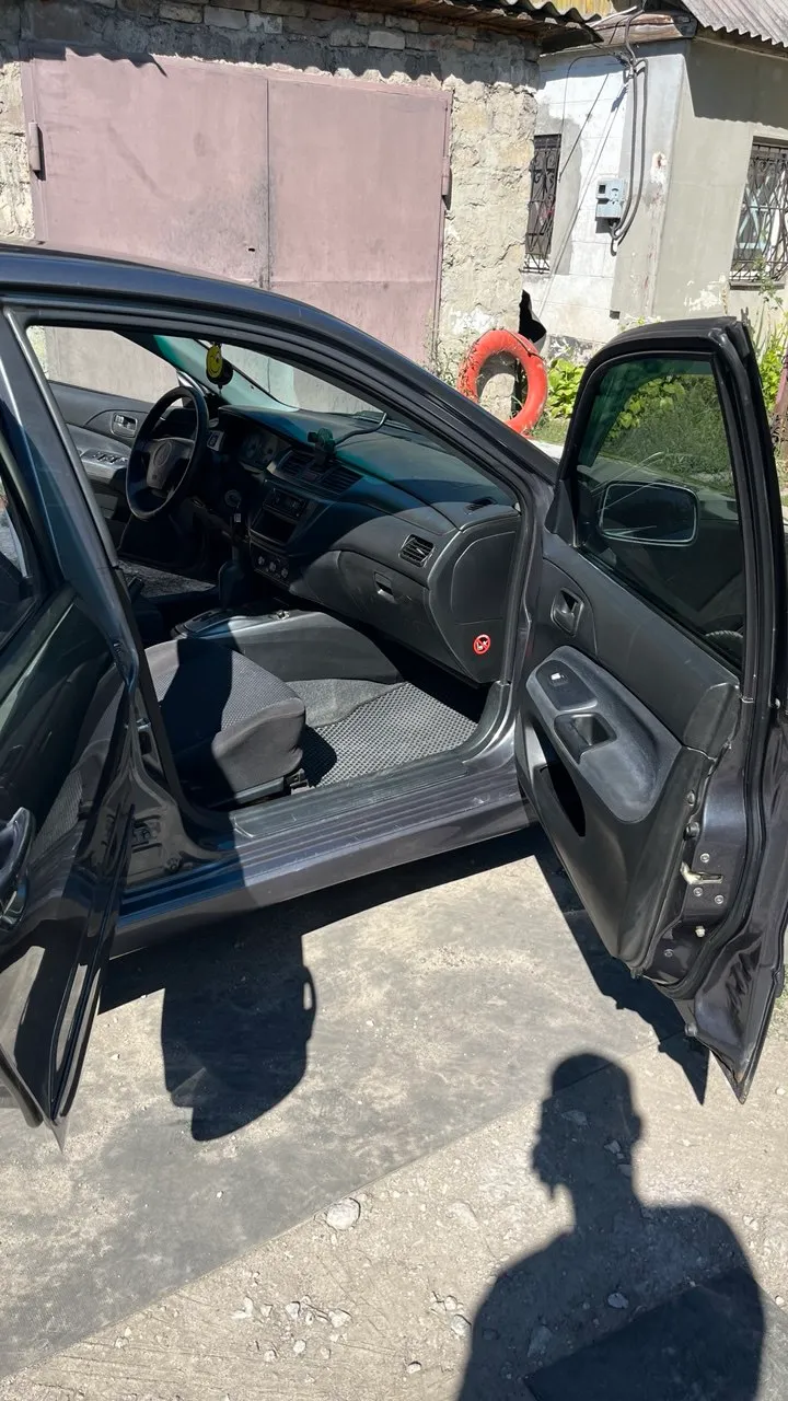 Mitsubishi Lancer - фото 7