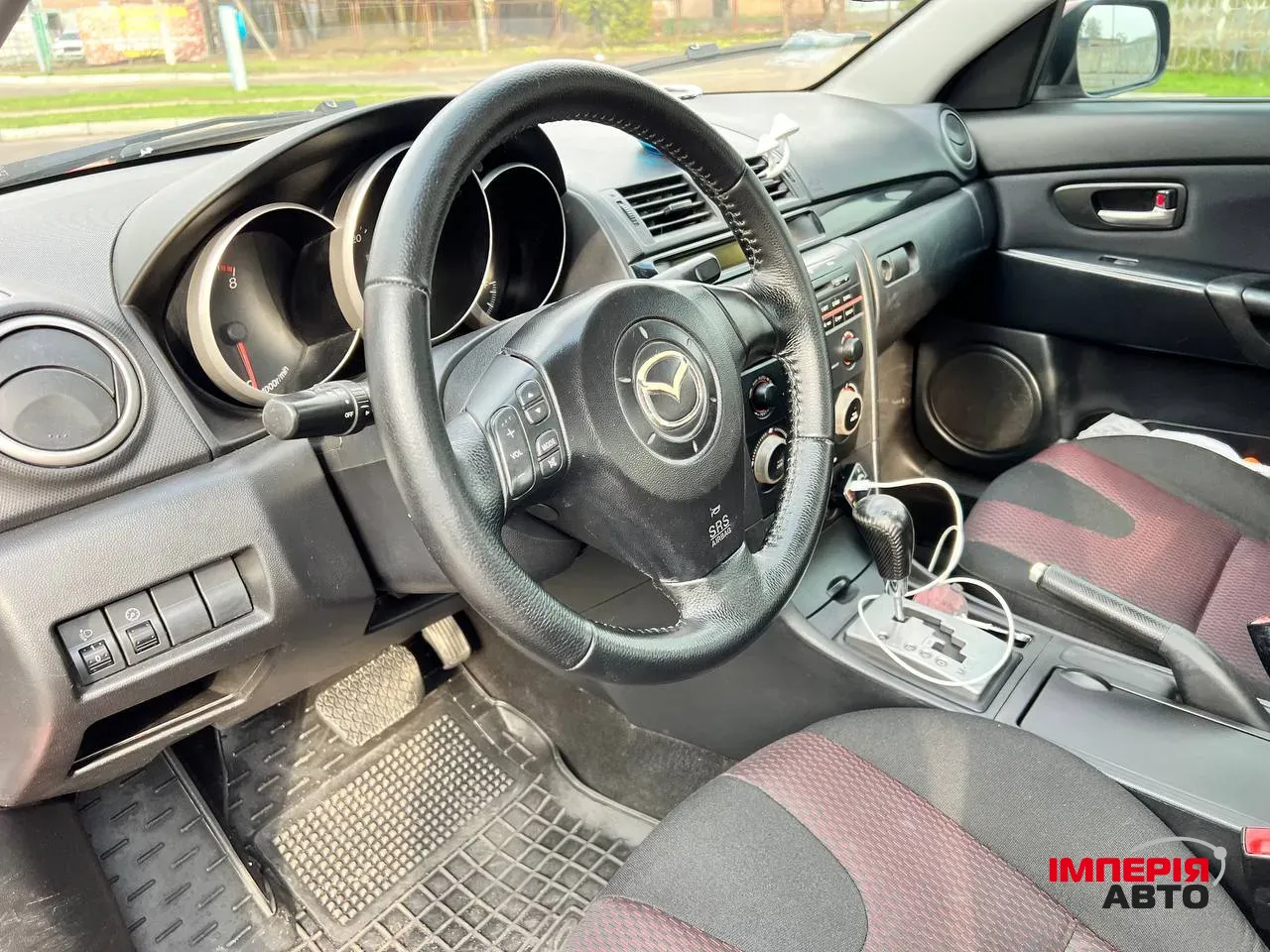 Mazda 3 - фото 11