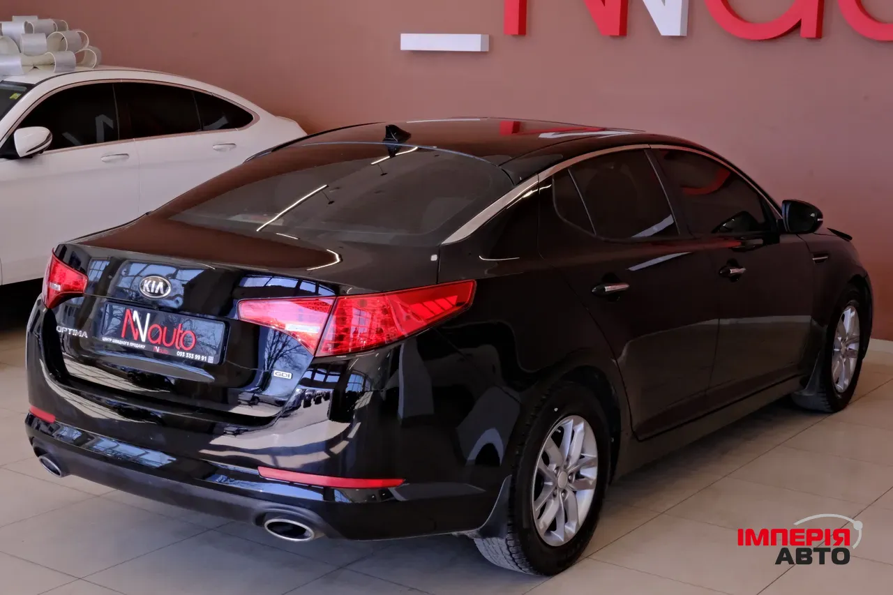 Kia Optima - фото 5