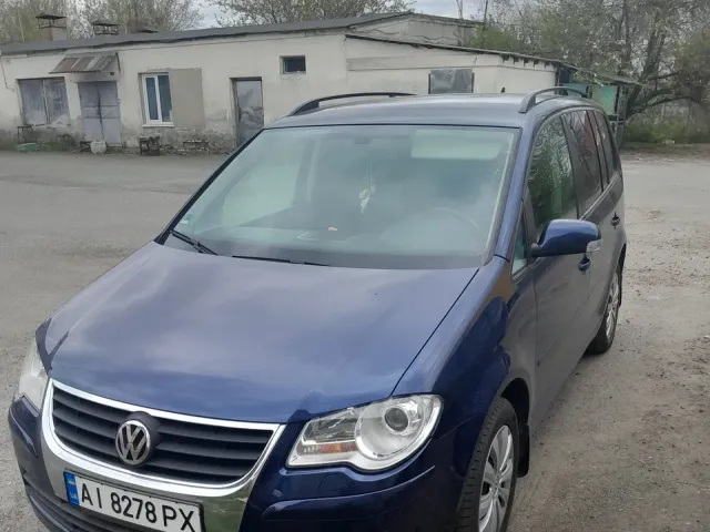 Volkswagen Touran - фото 1