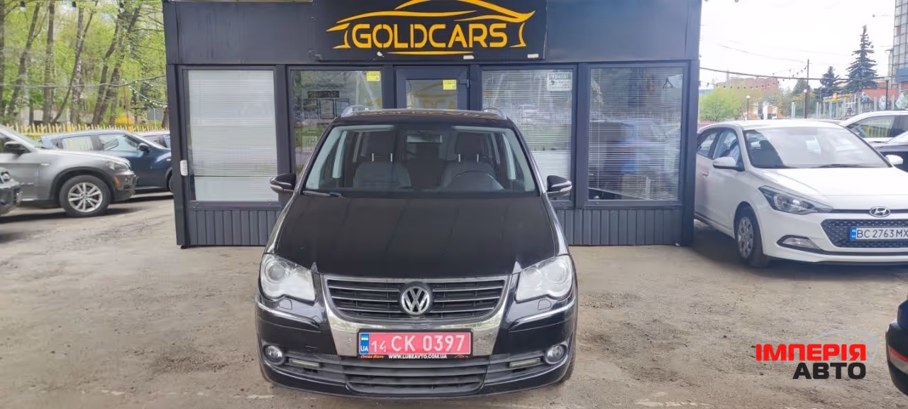 Volkswagen Touran - фото 1