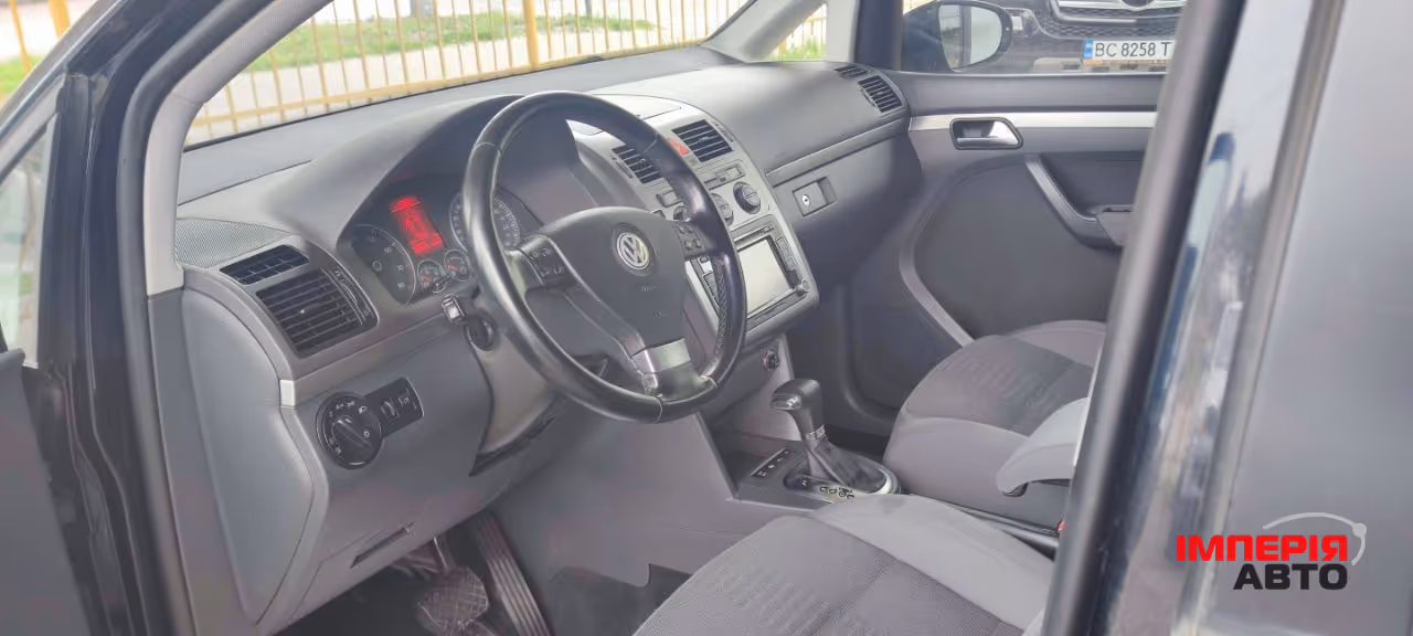 Volkswagen Touran - фото 7