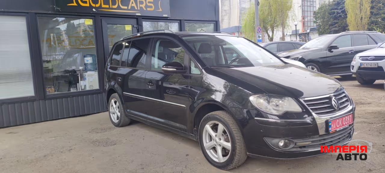 Volkswagen Touran - фото 2