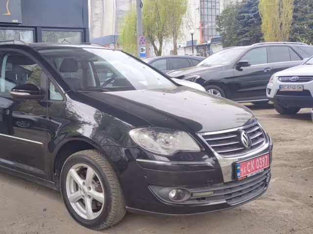 Volkswagen Touran - фото 2