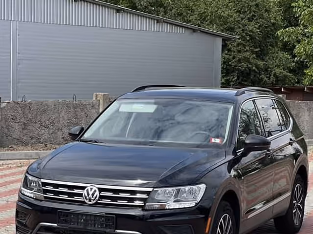 Volkswagen Tiguan - фото 1