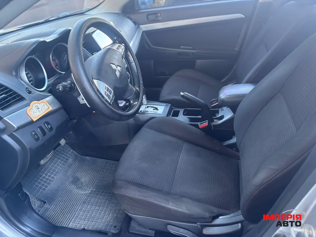 Mitsubishi Lancer - фото 12