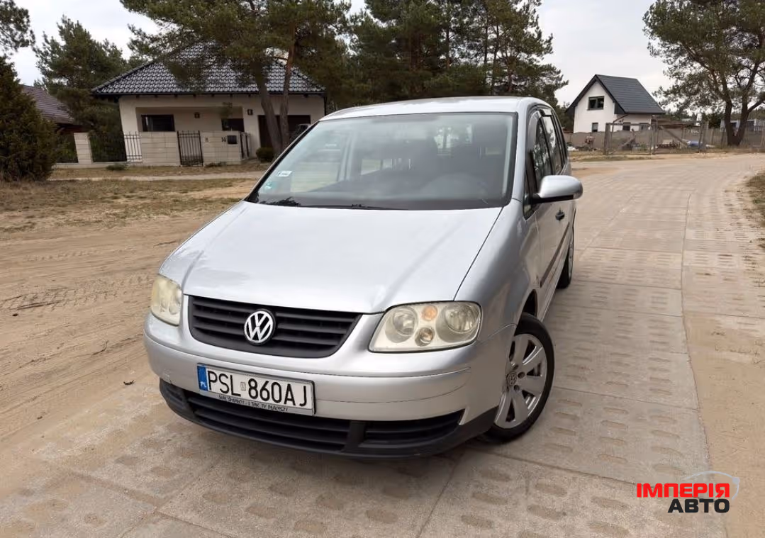 Volkswagen Touran - фото 1