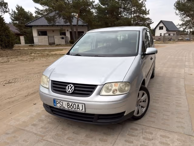 Volkswagen Touran - фото 1