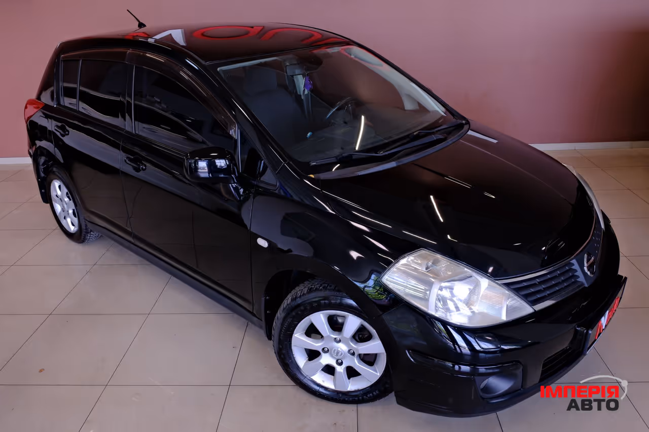 Nissan Tiida - фото 4