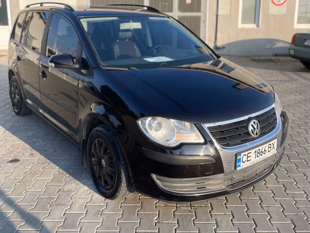 Volkswagen Touran - фото 4