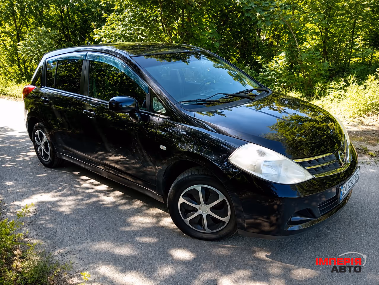Nissan Tiida - фото 3