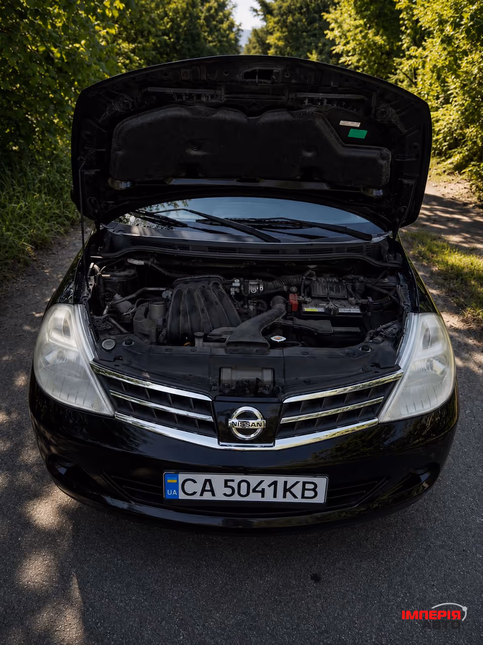 Nissan Tiida - фото 7