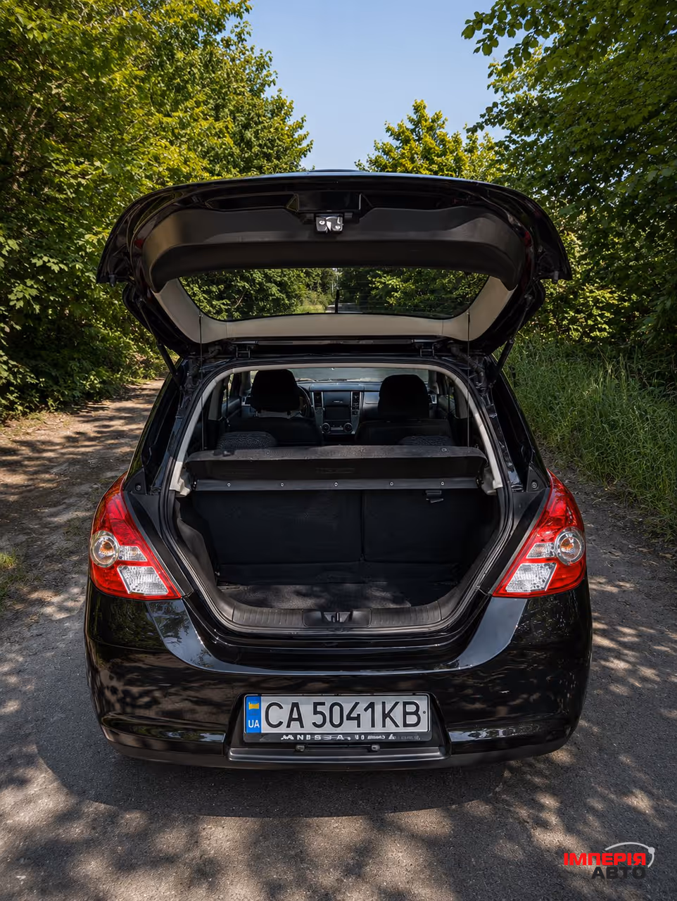 Nissan Tiida - фото 6