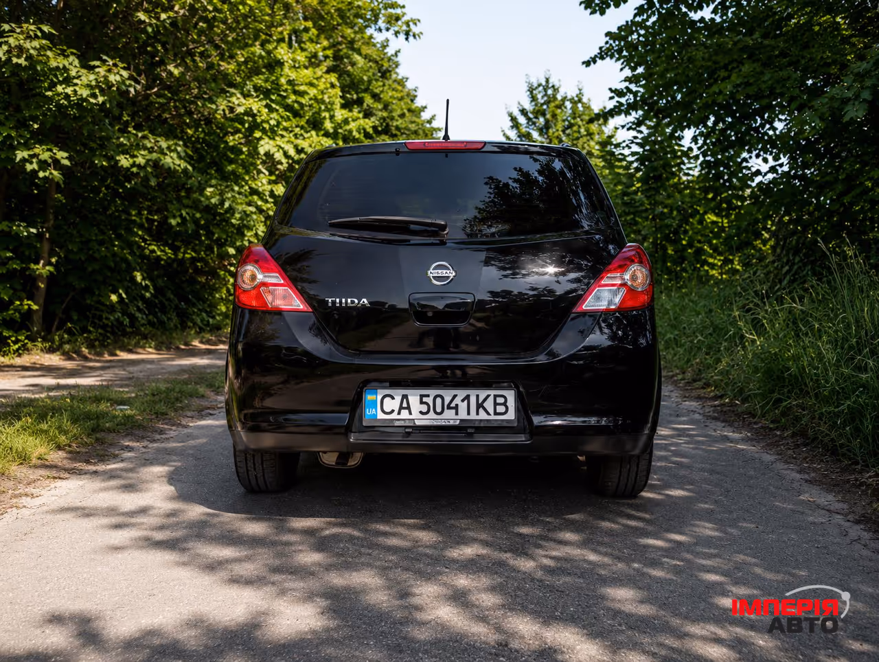 Nissan Tiida - фото 5