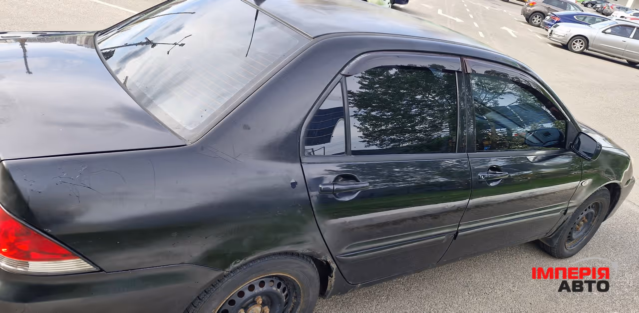Mitsubishi Lancer - фото 7