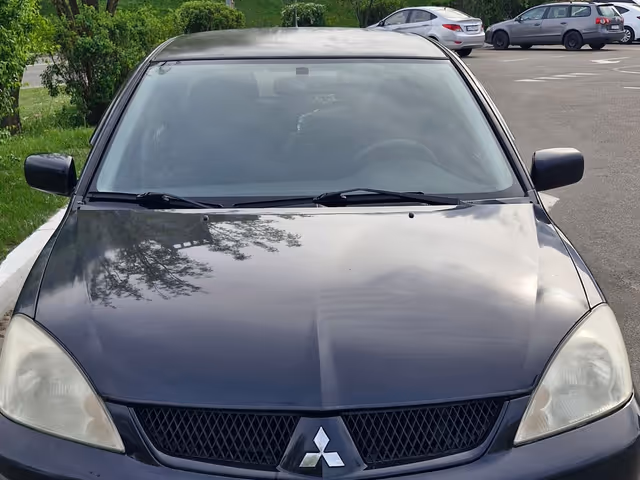 Mitsubishi Lancer - фото 1