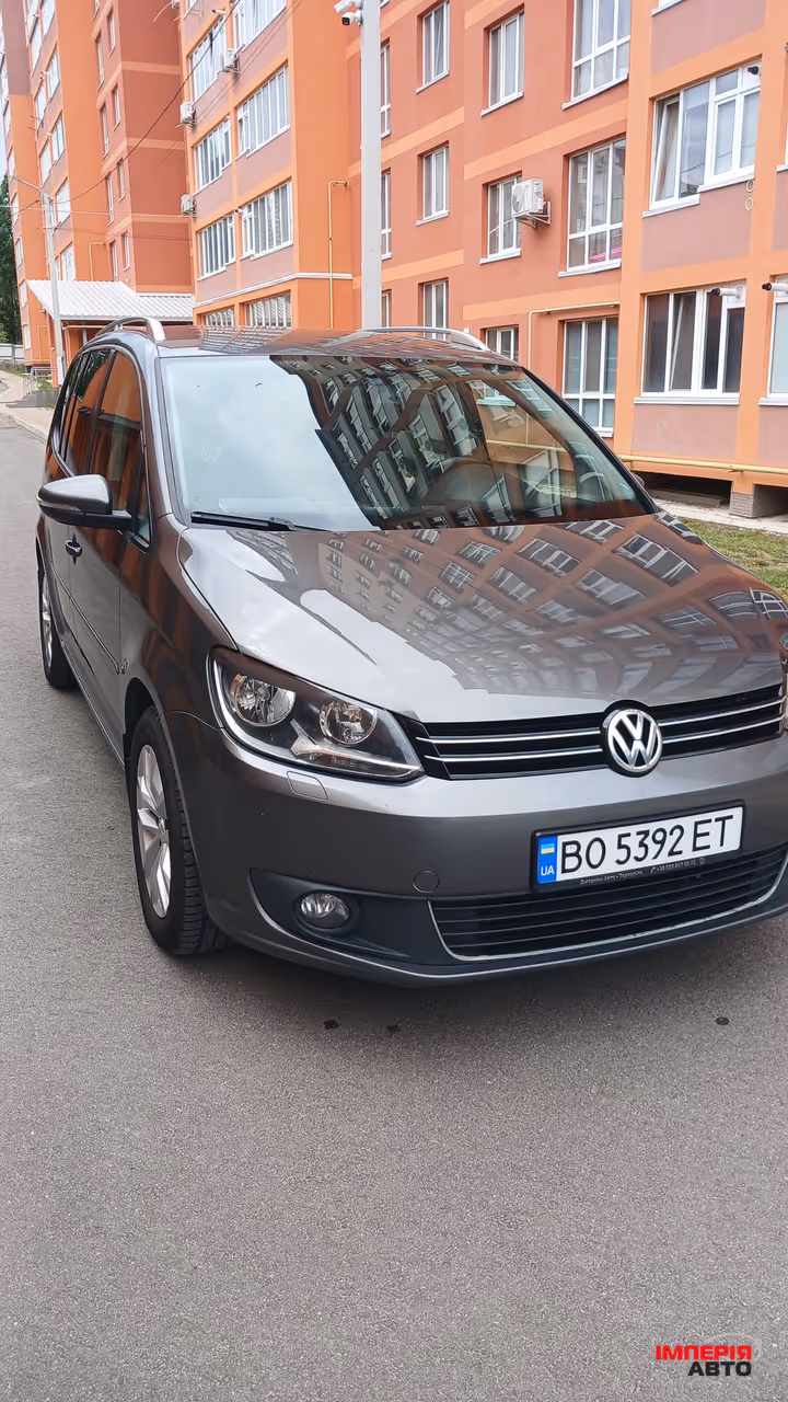 Volkswagen Touran - фото 1