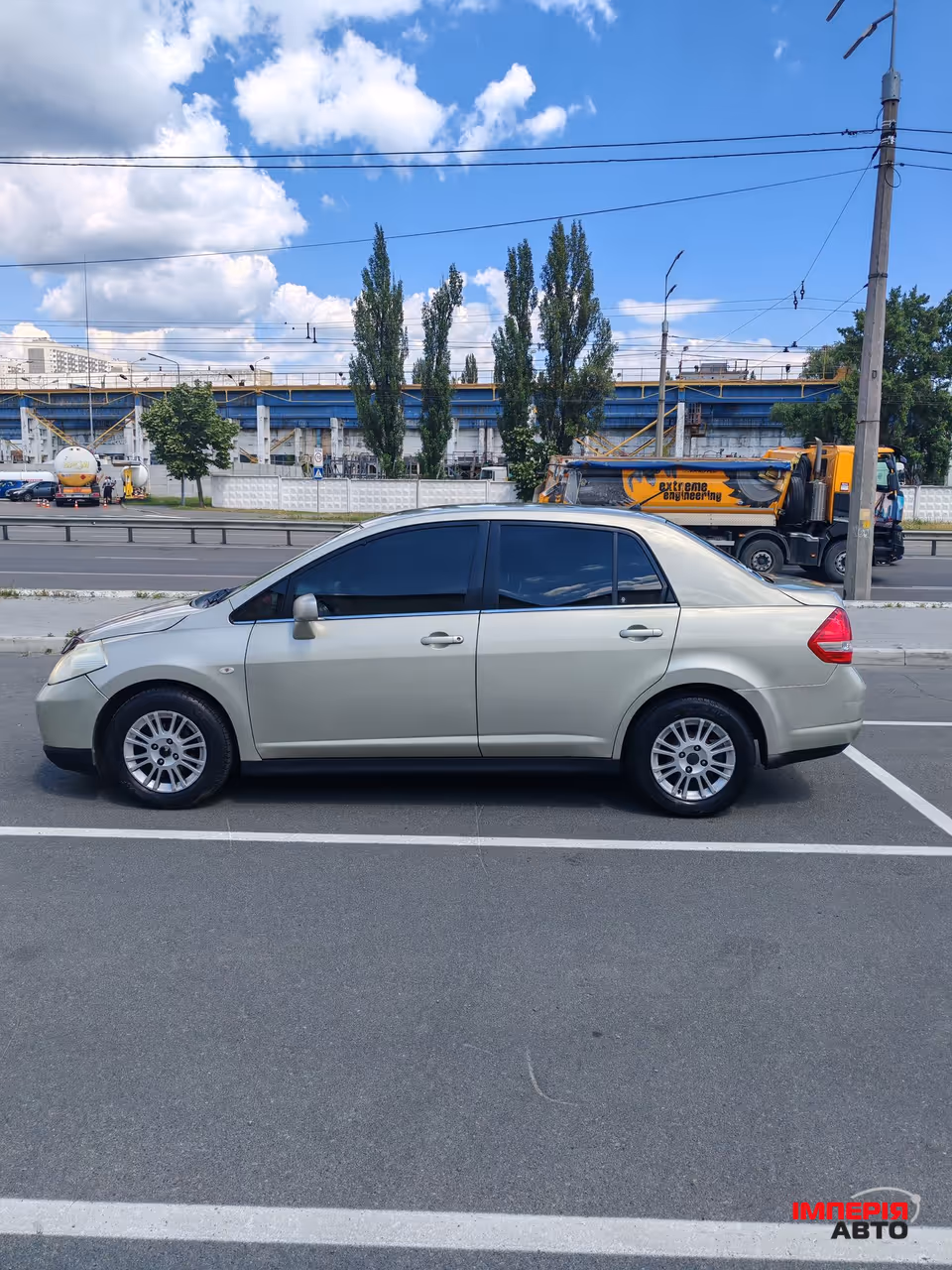 Nissan Tiida - фото 5