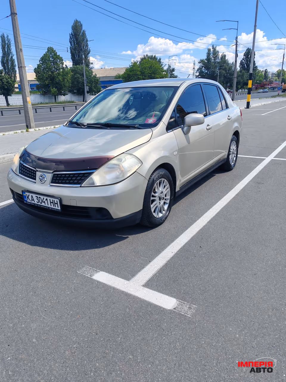 Nissan Tiida - фото 1