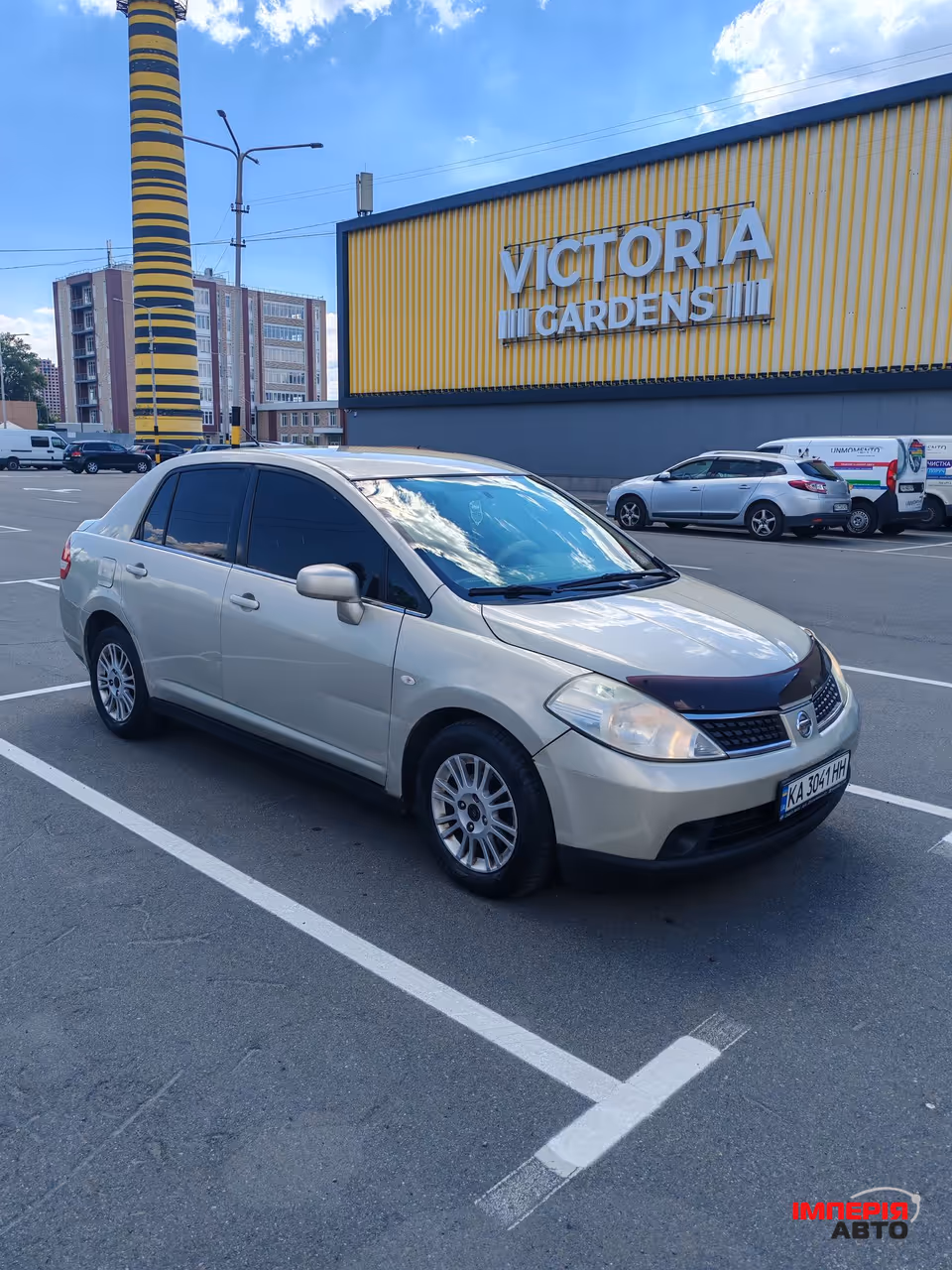 Nissan Tiida - фото 3