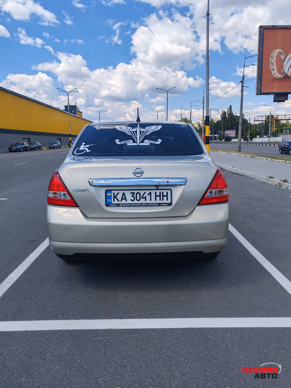 Nissan Tiida - фото 6