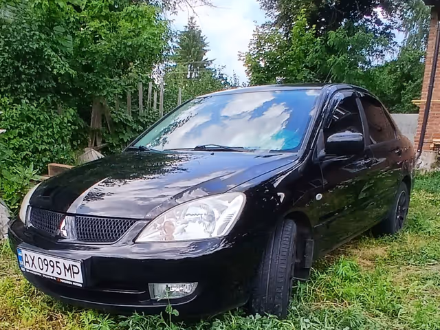 Mitsubishi Lancer - фото 1